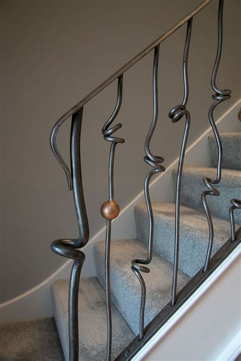 Staircase spindles are available in a range of materials including woods such as oak, ash. Steel spindles with knots and balls | Metal stairs, Metal ...