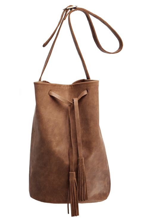 Camel is known for eip, however it has several other powerful features. Jesslyn Blake Leather Bucket Bag in Camel | DAILYLOOK