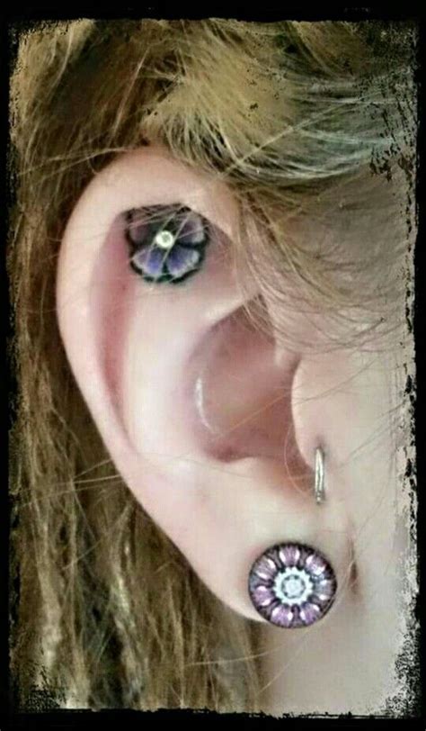 A daith piercing is situated in the cartilage of your inner ear. inner ear tattoo & Piercing | Ear tattoo, Toe ring tattoos