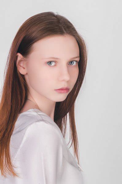 Dressed in pink dress in studio on white background. Beautiful 13 year old girl | A beautiful 13-years old girl dressed in pink dress in studio on ...