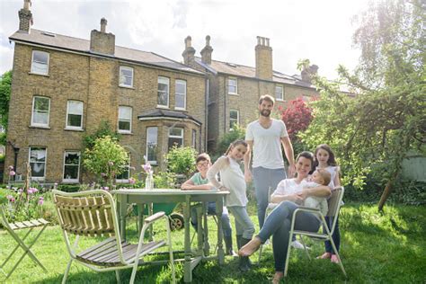 98% of 6,382 customers recommended. Happy Family In Sunny Back Garden With Suburban Family ...