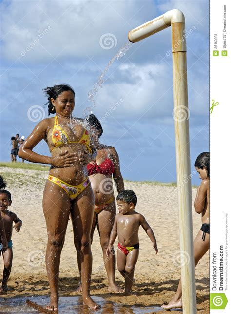 Try out some fun new dance moves in the shower before you take them out into the world. Portrait Of Showering Woman On The Beach, Brazil Editorial ...