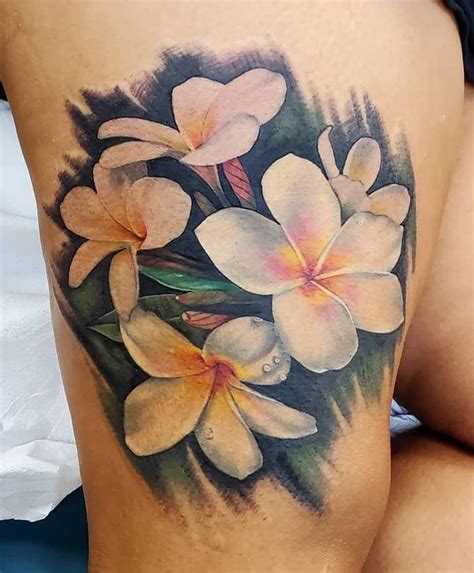 Pretty wave with sunset and plumeria flowers, done on guy's arm. Plumeria Tattoos: Tattoo Styles, Meanings & More