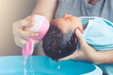 A bath of the whole body can be given 3 to 4 times a week. Cute Asian Newborn Baby Girl Take A Bath Mom Cleaning Her ...