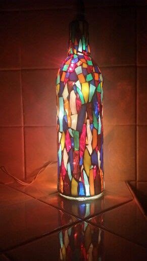 Maybe you would like to learn more about one of these? Multi colored stained glass wine bottle. Bottle is lit ...