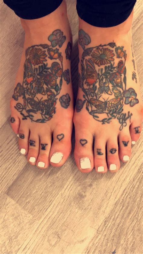 The long nails and arm tattoos are on full display. Gel polish pedi, tattoo feet, skulls, obey love. | Foot tattoos, Pink nails, Pedi