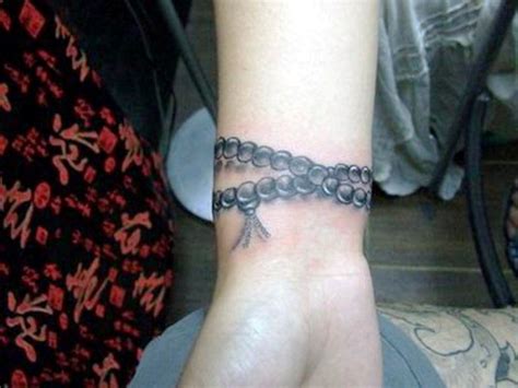 Grey ink motorcycle chain tattoo on left wrist. Wrist Tattoo Designs (With images) | Tattoo bracelet ...