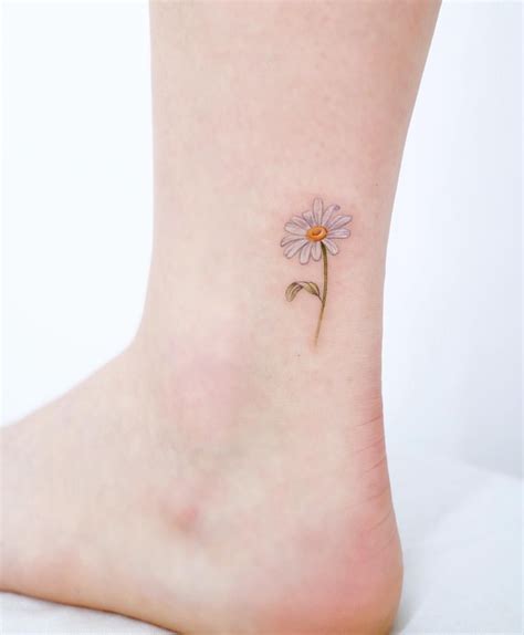 Your placement will likely depend on the size of the tattoo, as well as whether or not you include the stems, multiple flowers, or falling petals. Bellis perennis 🌼 (With images) | Small daisy tattoo