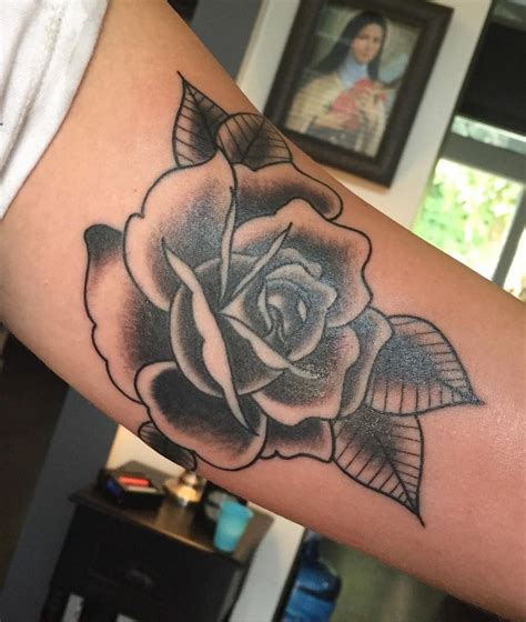 A black rose tattoo also symbolizes rebirth, reincarnation, and rejuvenation, strength and courage, revenge, devotion, and tragic or unfulfilled love. jakitatu:rose-inner-bicep-traditional-traditional-rose ...