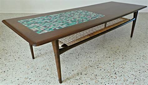 The coffee table is uniquely designed to impress and be added to your room. Poul Jensen for Selig tile inlay teak surfboard coffee ...