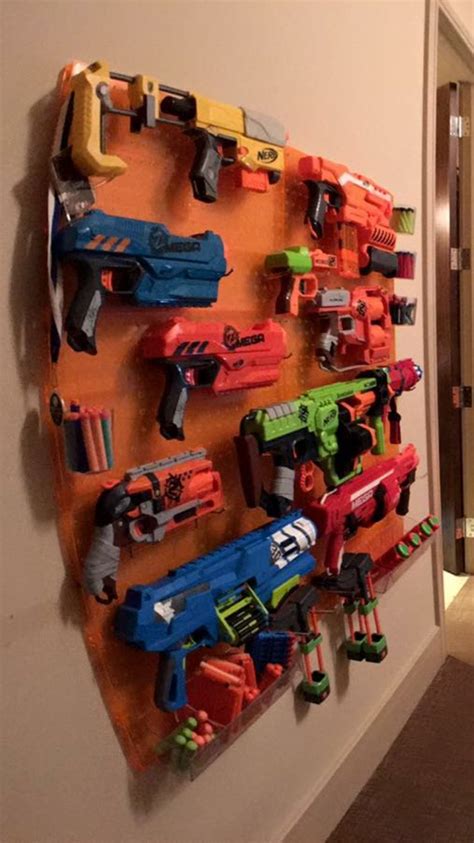 The nerf gun storage wall that you need at your house! Pin on Home ideas