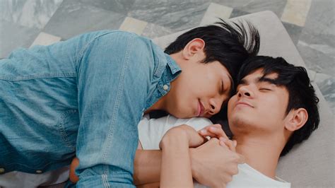 Young Asian gay couple sleep together at home. Teen korean LGBTQ+ men happy relax rest lying on ...