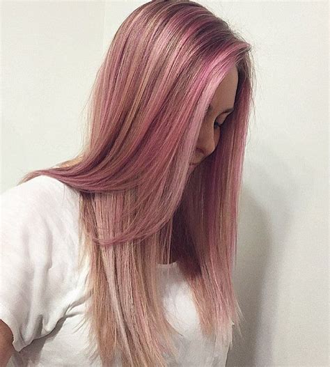 The pink highlights blend nicely with the blonde to give the hair a lot of depth and dimension. Bronde Hair With Pastel Pink Highlights | Blonde hair with ...