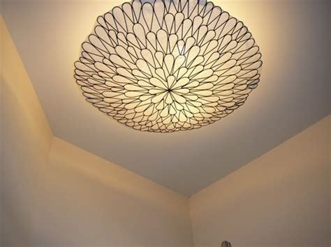 We've all seen our fair share of ugly ceiling light fixtures. Cool idea, wall hanging turned into light cover. (With images) | Ceiling lights, Diy ceiling