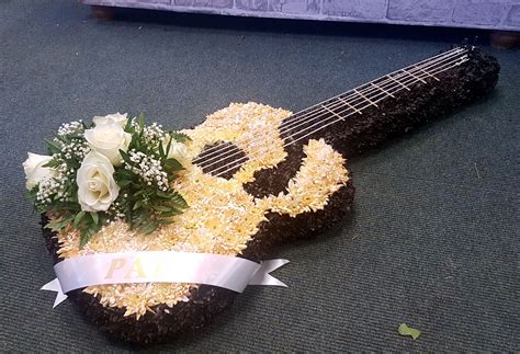 At flowers made easy our florists use only the best and freshest flowers direct from the grower. Guitar funeral tribute created by Poppies #funeralflowers ...