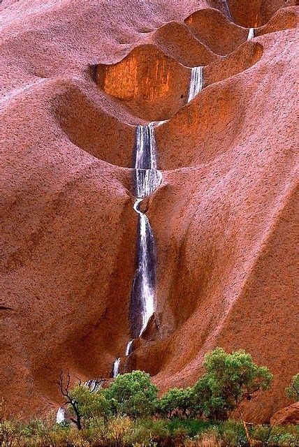 Uluru, also known as ayers rock and officially gazetted as uluru / ayers rock, is a large sandstone rock formation in the southern part of the northern territory in australia. Uluru Waterfalls, Australia. Want to go. | Beautiful ...