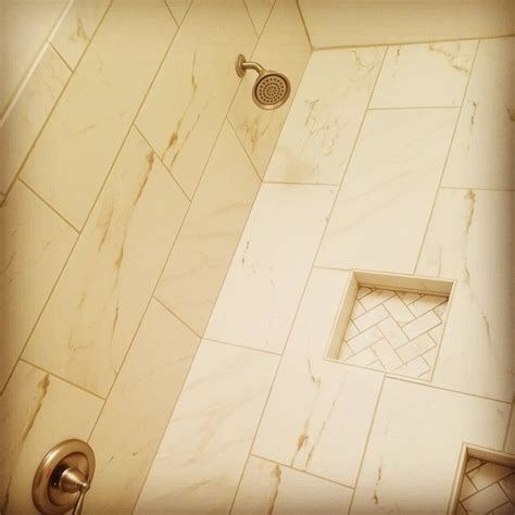 Just wipe the tub with a soft cloth and warm soap water every day. 12x24 tile tub surround with herringbone pattern insets ...