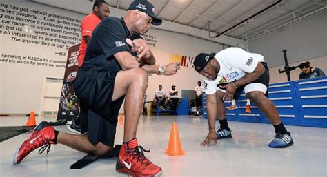 It was 6, but in 2018 the rules changed to allow only 5 people over the wall. NASCAR Pit Crews: Hidden Athletes of Car Racing