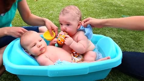 For bathing small babies who cannot sit on their own yet, you can strap one baby in her infant chair while you bathe the other and then switch them up after. Baby Bath Time Twins Babies Cute Finding Nemo Bathtub Toys ...