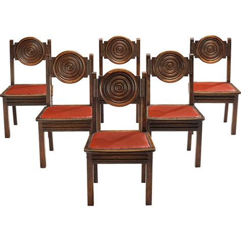 Two chairs are colorfully hand painted with an animal/alphabet motif on the wood backs and seats. Antique Dining Room Chairs - 11,998 For Sale at 1stdibs