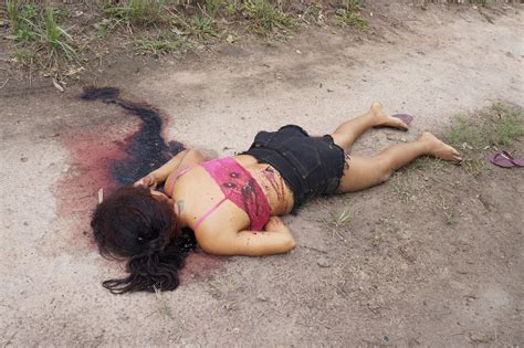 Examination of the corpse of dead chinese woman. girl shot>site:documentingreality.com