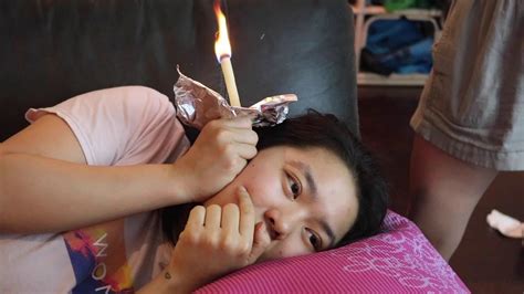 Fill a glass half way full of water and place it near the location in which the ear candling will be done. GROSS: Ear Candling for the First Time | cocohong - YouTube
