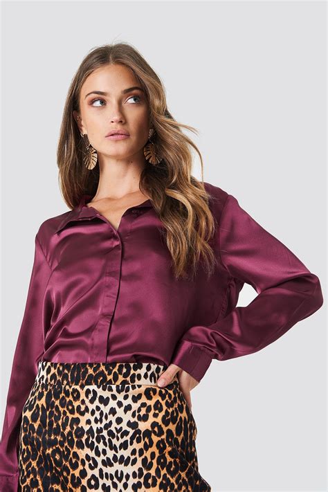 Ici seulement du x taboo. The Rebecka Satin Shirt by Rut&Circle features a collared neckline, hidden buttons down the ...