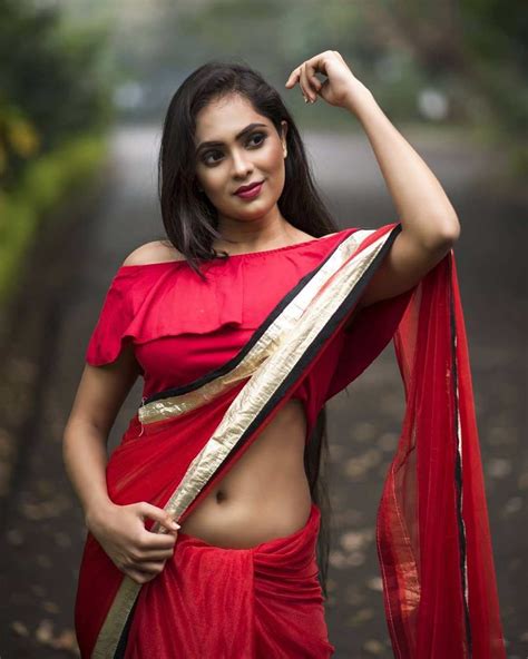 Wear saree below navel how to wear saree below navel without blouse. Beautiful Lady in Red Saree in 2020 | Unique blouse designs, Unique blouse, Red saree