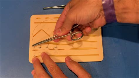 This uses vertical mattress sutures and tubing from a giving set. horizontal mattress suture, by Dr. Carlo Oller - YouTube