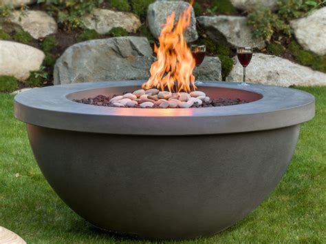 It's designed so that the fire actually sits below the level of the stone patio, and the sight of flames shooting up from below is very cool. A Romantic Fire Pit Proposal in Massachusetts - Solus Fire ...