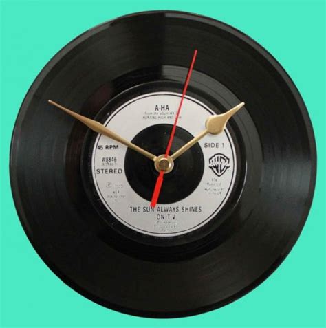 Wake up to the time projected in large digits on your bedroom wall or ceiling with this projection alarm clock. A-HA - The Sun Always Shines On TV - Vinyl Clocks