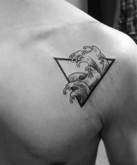 A hot lower back flourish tattoo. ocean-wave-triangle-guys-simple-upper-chest-tattoo-designs ...