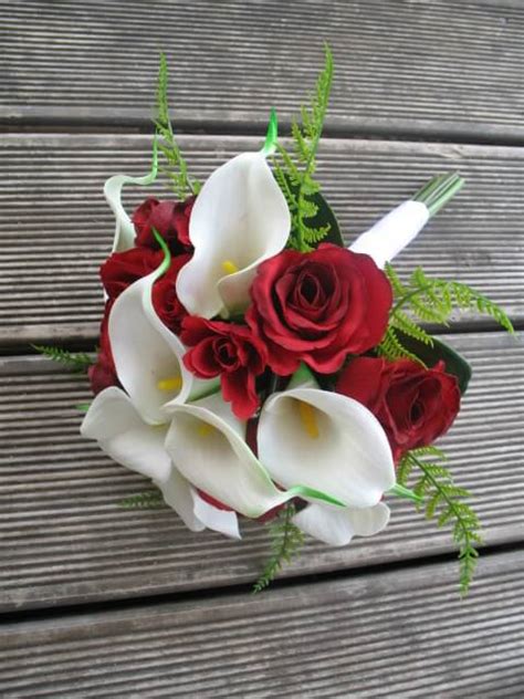 Choose a miniature calla lily flower in a hue that echoes the bridal bouquet. Red roses and calla lilies $65 - Keepsake Bouquets