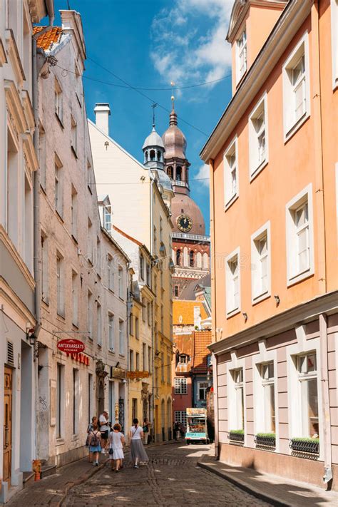 Personal perspectives featuring photographs and travelogues. Riga, Latvia. People Walking On Narrow Cobbled Kramu ...