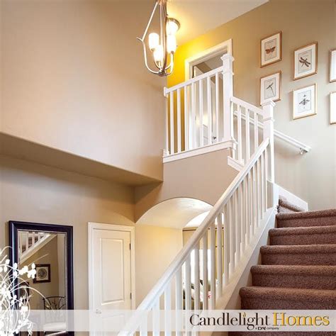 It was originally built as the manchester and southport railway. www.CandlelightHomes.com, utah, homebuilder, staircase, stairs, white railing, wall art, tan ...