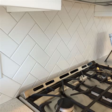 3x6 white subway tile backsplash herringbone. 3x6 white subway tile in a herringbone pattern with light ...