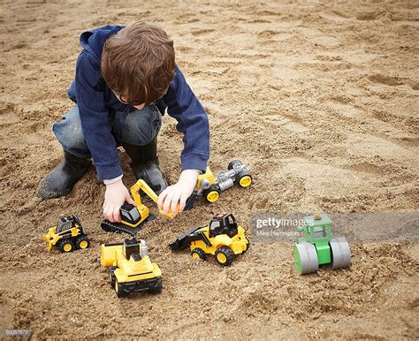 To try and tease out the effects of nature over those of nurture, wallen and his colleagues. Young Boy Playing With Toy Diggers In San High-Res Stock ...