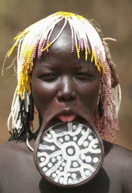 It is often done for aesthetics, sexual enhancement, rites of passage, religious beliefs, to display group membership or affiliation, in remembrance of lived experience. Mursi - Body modifications