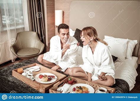 Husband Sharing Piece Of Bacon With His Appealing Lovely Wife Stock Photo - Image of husband ...
