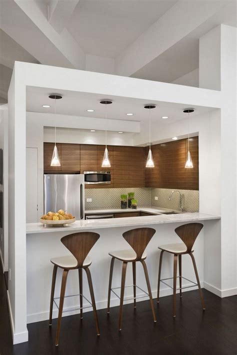 Small modern kitchen with faux gold metal backsplash and black cabinets open to living room. kitchen | Kitchen bar design, Kitchen remodel small ...