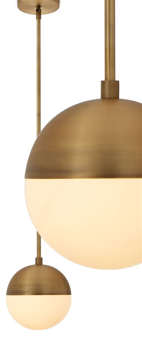 Crafted from metal in a versatile solid finish, this statement piece features a rectangular canopy with a row of spherical glass shades adorned with caps suspended below. Powell LED 7 | Kitchen pendants, Mid century modern ...