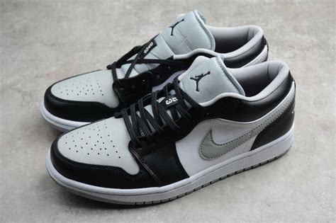 White at the mid panel, light smoke grey at the toe and swoosh, and black on the collar and overlays. Air Jordan 1 Low Black Light Smoke Grey 553558-039 ...
