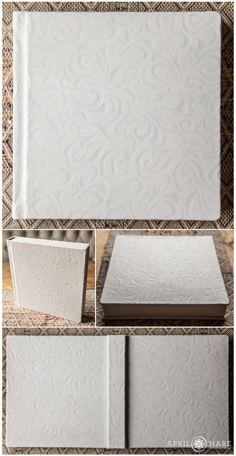 Family or wedding photo album with blank space for text, hydrangea flower bouquet, pink blanket, decoration on white background. Photos of Wedding Albums and Why They're So Important