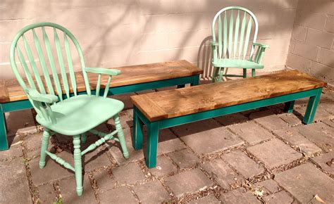 A welcoming, round farmhouse table draws the eye with its reclaimed wood top and a compelling architectural base in a rustic black olive finish. Custom painted farmhouse chairs and custom built and ...