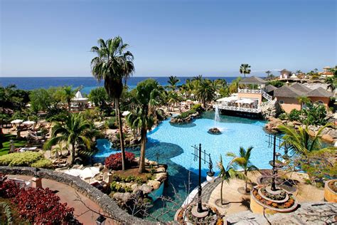 Picturesque patios lead to swimming pools that invite guests. Bahía Del Duque, Tenerife | Holidays 2021/2022 | Luxury ...