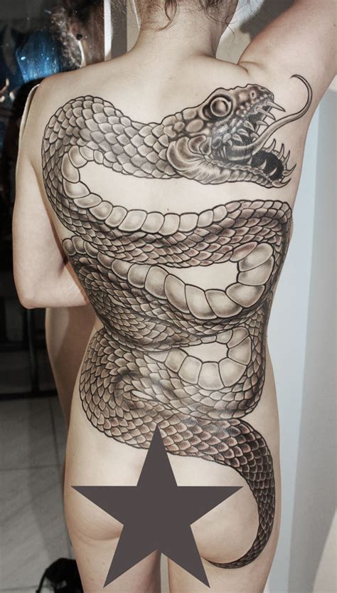 Leg tattoos for men can be incredibly masculine when the right design is applied. Snake Back Piece Cover Up | Tattoo Abyss