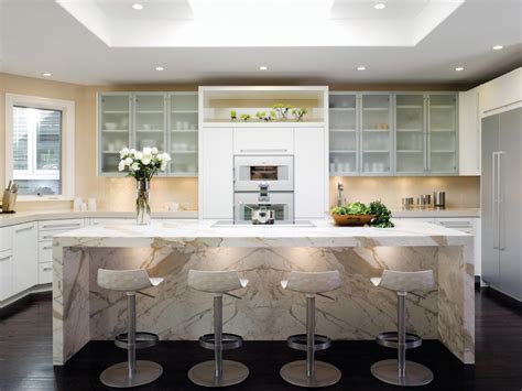 Warm white cabinets combines with superior grays and tans in the granite countertops, subway tile backsplash and porcelain tile floors. White Kitchen Cabinets: Pictures, Ideas & Tips From HGTV ...