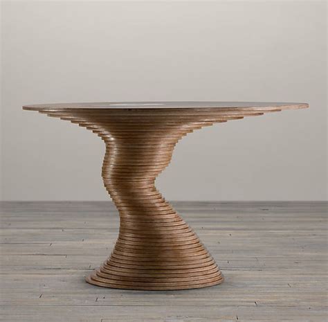 The cheapest piece of wood you can find made to look like the most expensive. Sculptural table made out from 50 plywood disks