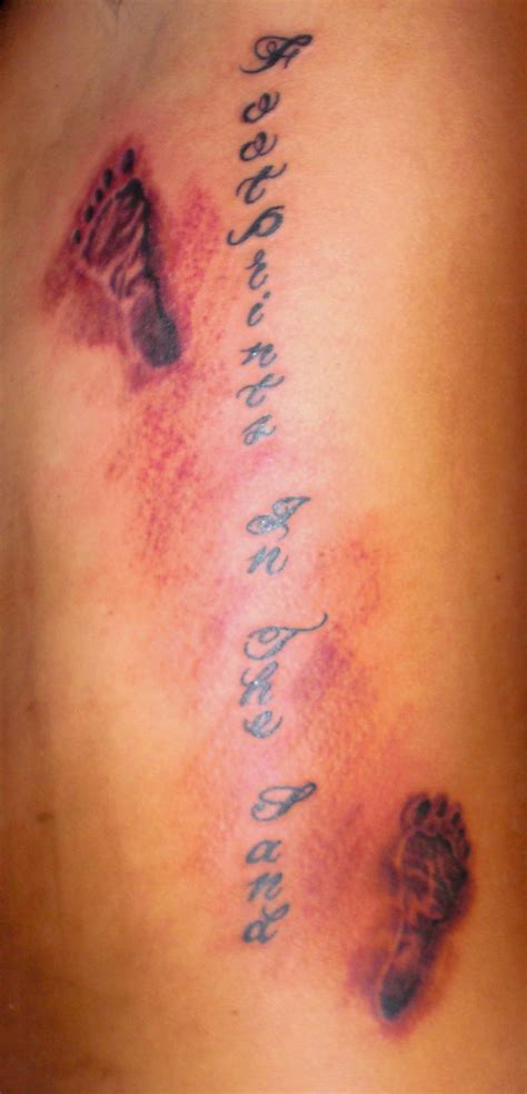 Memorial baby footprints tattoos on man chest. Foot Prints In The Sand Tattoo Pictures at Checkoutmyink ...