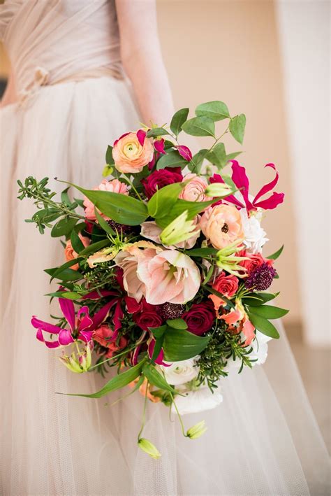 From designing white bridal bouquets, setting up luxurious wedding centerpieces to creating floral displays along the aisle. Beautiful summer floral wedding bouquet with orange and ...